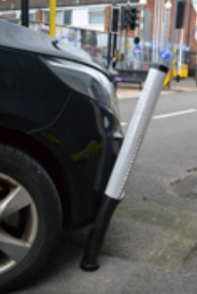 Quick-flex bollard being flexed by a car